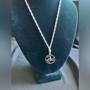Upcycled vintage Sarah Coventry silver chain with Celtic  Triskele pendant.
